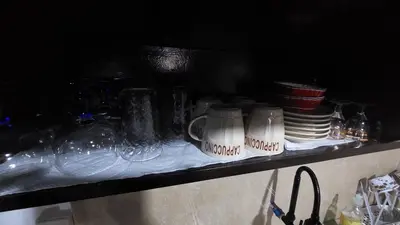 a shelf with wine glasses and plates on it at Affordable Whole house 2-story 3 bedroom Greenpark villas imus phase 1 in Imus