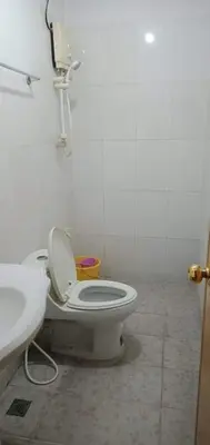 a bathroom with a toilet and a sink at Asia Novo Boutique Hotel - Cabuyao Laguna in Cabuyao