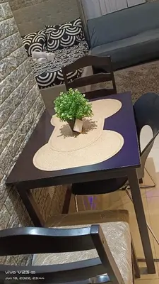 a table with a plant sitting on top of it at Nethcondo in Manila