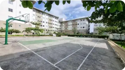 an empty basketball court in front of a building at Joms Minimalist Crib Nuvali in Calamba