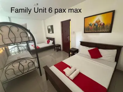 a bedroom with two bunk beds and a family unit pay max at Casa Maria by Juemarst Suites in Manila