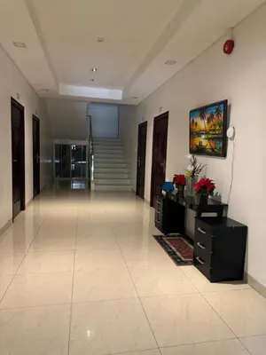 a large hallway with a staircase in a building at Casa Maria by Juemarst Suites in Manila