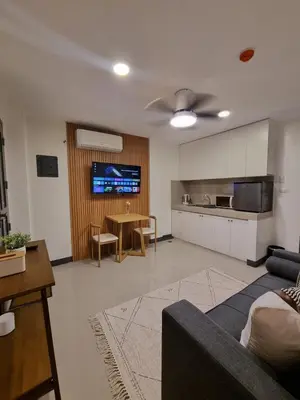 a living room with a couch and a table at Flat 35, Unit 3C in Manila