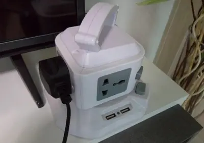 an electronic device sitting on a table on a table at Avant Apartments at The Fort in Manila
