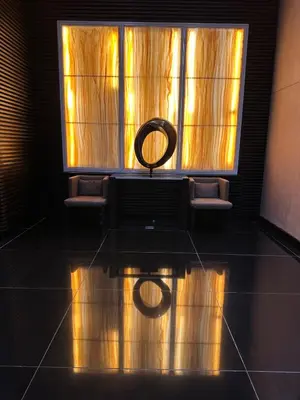 a room with a window with a round mirror on the floor at 1BR Air Residences condo, Ayala Ave, Makati in Manila