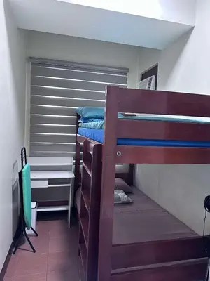 a bedroom with two bunk beds in a room at Phebestaycation in Manila