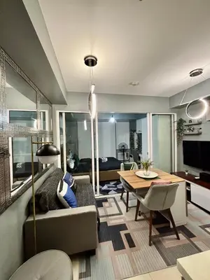 a living room with a couch and a table at Casa Valentine - Azure Urban Resorts Residences in Manila