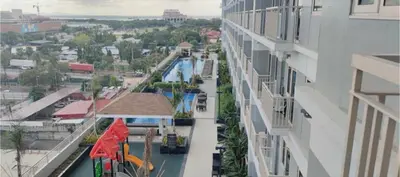 a view of a swimming pool from a building at Coast Residences Pasay City 1 bedroom in Manila