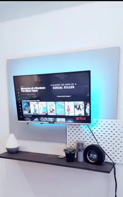 a flat screen tv sitting on a shelf at Mall of Asia Condo Pasay in Manila