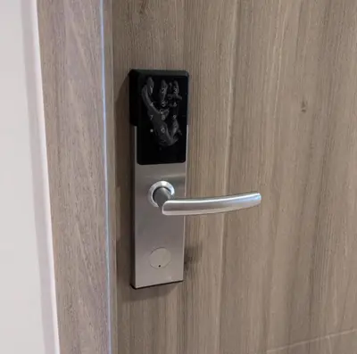a metal door with a cell phone in it at Mall of Asia Condo Pasay in Manila