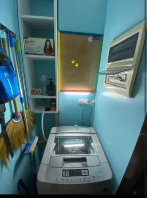 a kitchen with a toaster oven in a refrigerator at One Palm Tree Villas Near NAIA terminal 3 in Manila
