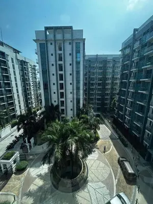 a view of a city with palm trees and buildings at One Palm Tree Villas Near NAIA terminal 3 in Manila