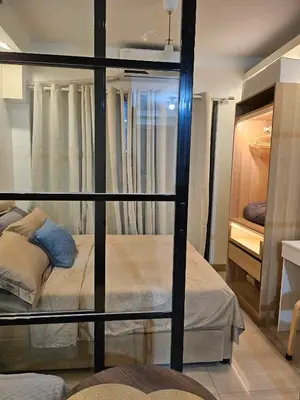 a bedroom with two bunk beds in a room at Adventura Staycation in Manila