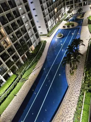 an overhead view of a swimming pool in a building at Adventura Staycation in Manila
