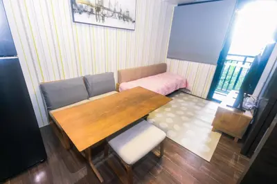 a dining room with a wooden table and chairs at Urban Oasis Sleep in Style Makati Comfy Gym Swim Park 914 in Manila