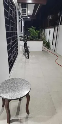 a motorcycle parked in a room with a table at Short Stay BF Resort in Manila