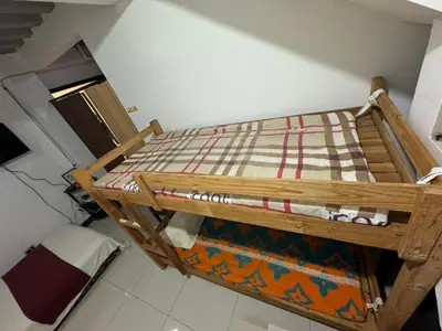 a wooden bunk bed in a room at 143 Private Resort in Trece Martires