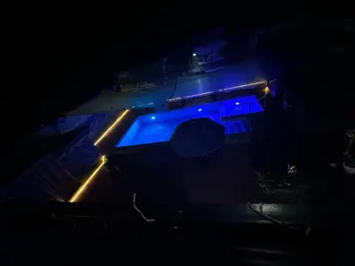 an overhead view of a swimming pool at night at 143 Private Resort in Trece Martires