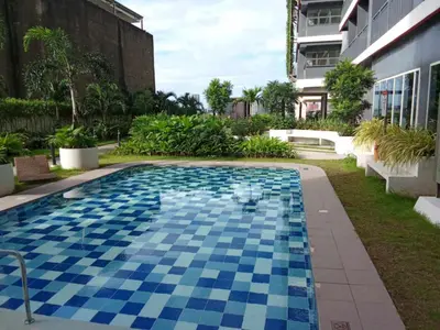 a swimming pool in the middle of a building at SMDC Red residences Condominium Makati City in Manila