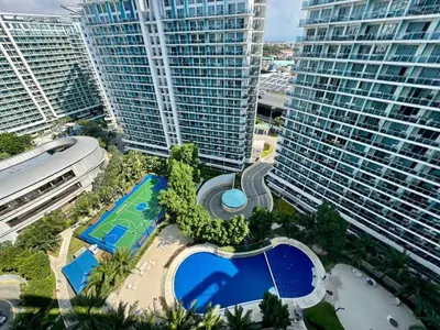 an aerial view of a large building with a pool at Casa Elisha Azure Urban Resort Staycation in Manila