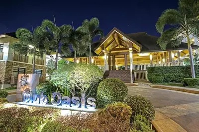 a house with a sign in front of it at Staycation with Mickey & Minnie One Oasis Pasig in Manila