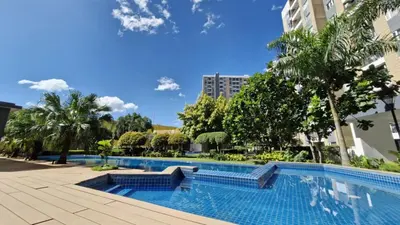 a swimming pool in the middle of a building at NEW! The Hive Residences - 1BR with Balcony & FREE Parking at Casa Arbo in Taytay
