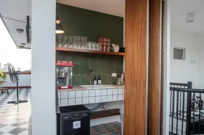 a kitchen with a sink and a counter top at MiraNamin SAMPAGUITA - Two Bedroom Suite in Historic Home with Indoor Plunge Pool, Self-Service Breakfast, Garden View, Pet-Friendly in Manila