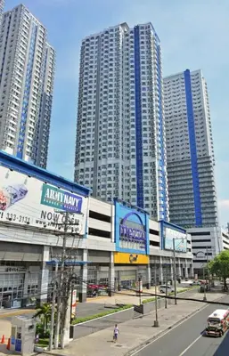 a city street with tall buildings in the background at SM MEZZA 1 RESIDENCES Studio Room Gian Thyresse Crib in Manila