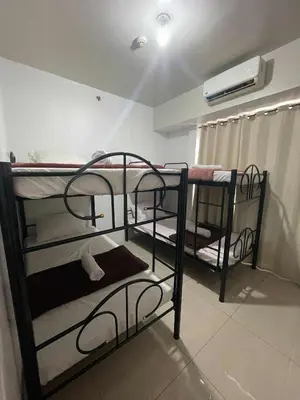 a room with two bunk beds in a room at 4kys staycation in Manila