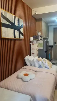 a bedroom with a bed with a towel on it at Casiana Place Staycation at Shore2 Residences in Manila