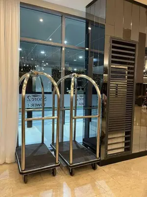a store with two metal racks in front of a window at Casiana Place Staycation at Shore2 Residences in Manila