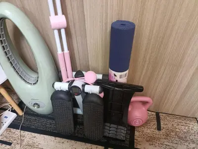 a group of toothbrushes in a holder next to a washing machine at Casiana Place Staycation at Shore2 Residences in Manila