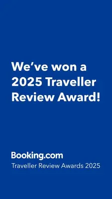 a blue sign that says weve won a traveler review award at 1BR Condotel with Balcony at SM Light Residences #LT13 in Manila