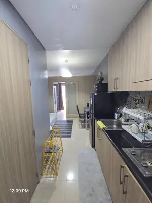 a kitchen with a sink and a counter top at Shore Residences Cozy oasis by Richnells Tower D in Manila