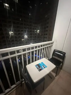 a table and chairs on a balcony with a view at Shore Residences Cozy oasis by Richnells Tower D in Manila