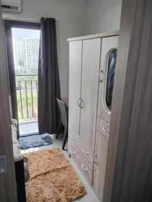 a bedroom with a large dresser and a window at VSV Luxury Family suits Moa staycation in Manila