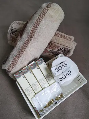 a group of products sitting on a pile of towels at VSV Luxury Family suits Moa staycation in Manila