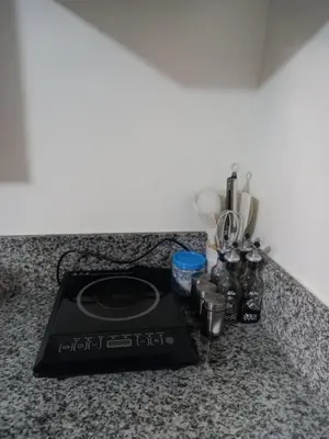 a stove top on a counter in a kitchen at Spacious Staycation in Pasig Urban Metro Escape in Manila