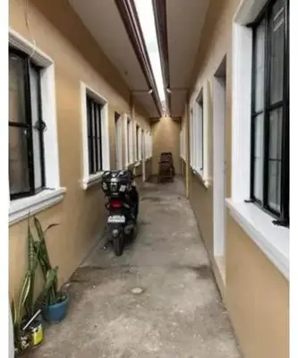 a motorcycle parked in the hallway of a building at Laureano di trevi tower 2 Condominium Corporation in Manila