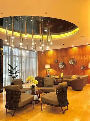 a living room with a couch and a table and chairs at 1573 Budget Condo near MOA and Airport in Manila