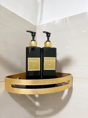 two bottles of soap sitting on a shelf in a bathroom at 1573 Budget Condo near MOA and Airport in Manila