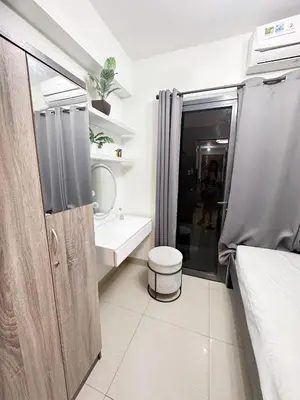 a bathroom with a sink and a toilet and a shower at 1573 Budget Condo near MOA and Airport in Manila