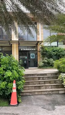 a traffic cone sitting in front of a building at Chelsea Tower 3 in Manila