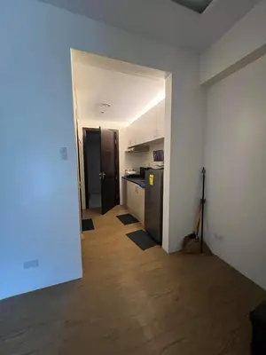an empty apartment with a kitchen and a hallway at Chelsea Tower 3 in Manila