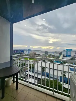 a balcony with a view of a highway at White House Staycation by Trixie Datiles in Manila