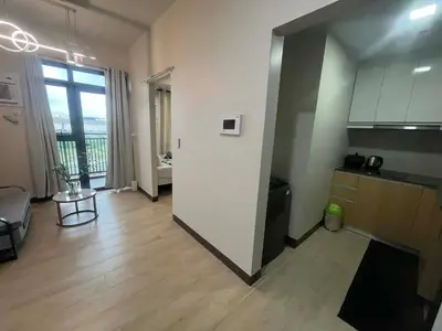 a large room with a kitchen and a living room at Gentry Manor Family Room 2 Beds Near Okada MOA NAIA 8E in Manila