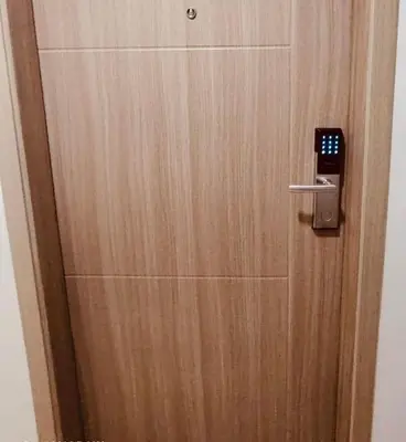 a wooden door with a lock on it at Kaunis Hive Hope Residences in Trece Martires