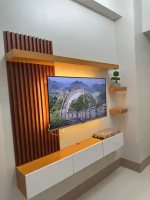 a flat screen tv sitting on a wall at Claire's place in Manila