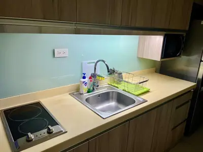 a kitchen counter top with a sink and a sink at Modern Comfort Living! Netflix Ready in Manila