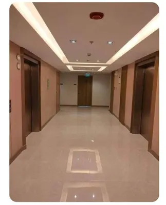 an empty hallway of a building with doors and ceilings at S-Residence Staycation Near IKEA,MOA,PICC in Manila